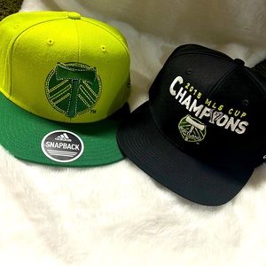 Two Portland Timbers snap back hats